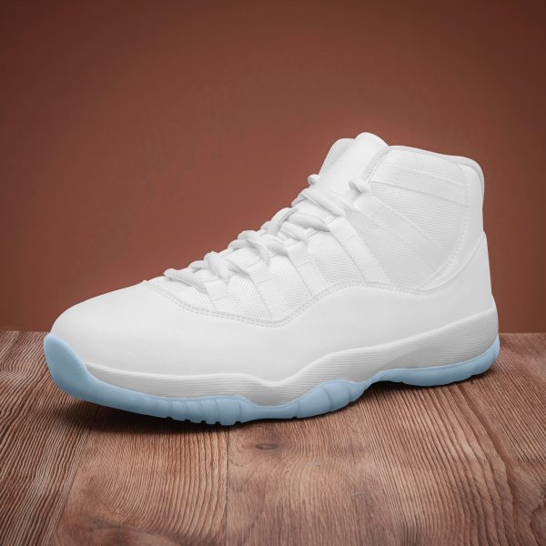 A pair of white customizable basketball shoes with blue soles