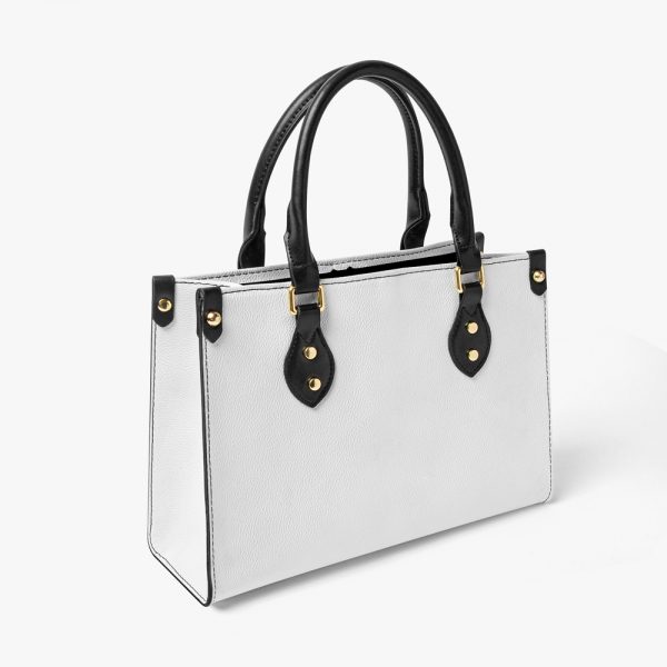 A women's white leather tote bag