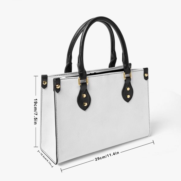 A women's white leather tote bag