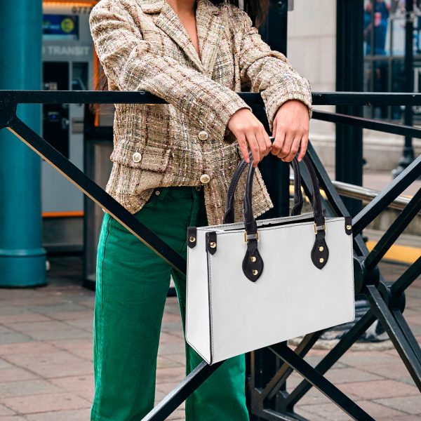 A women's white leather tote bag